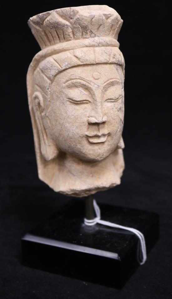 A Chinese marble head of a Bodhisattva, 15th century, in Northern Wei style, height 13cm, modern stand